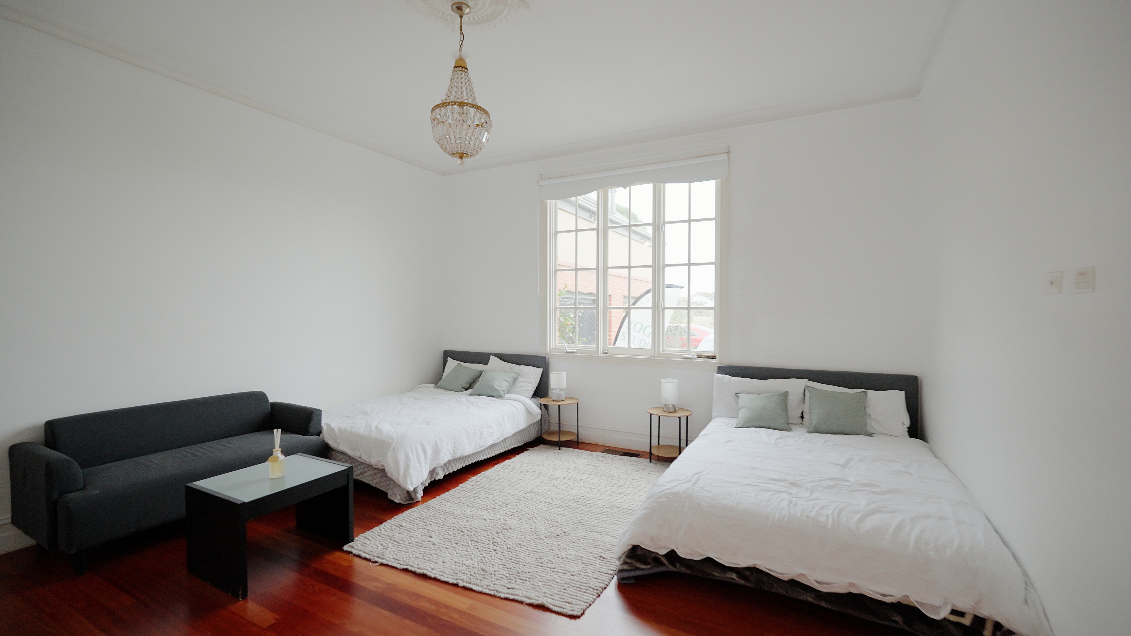 Private ensuite room with crystal chandelier and premium bedding